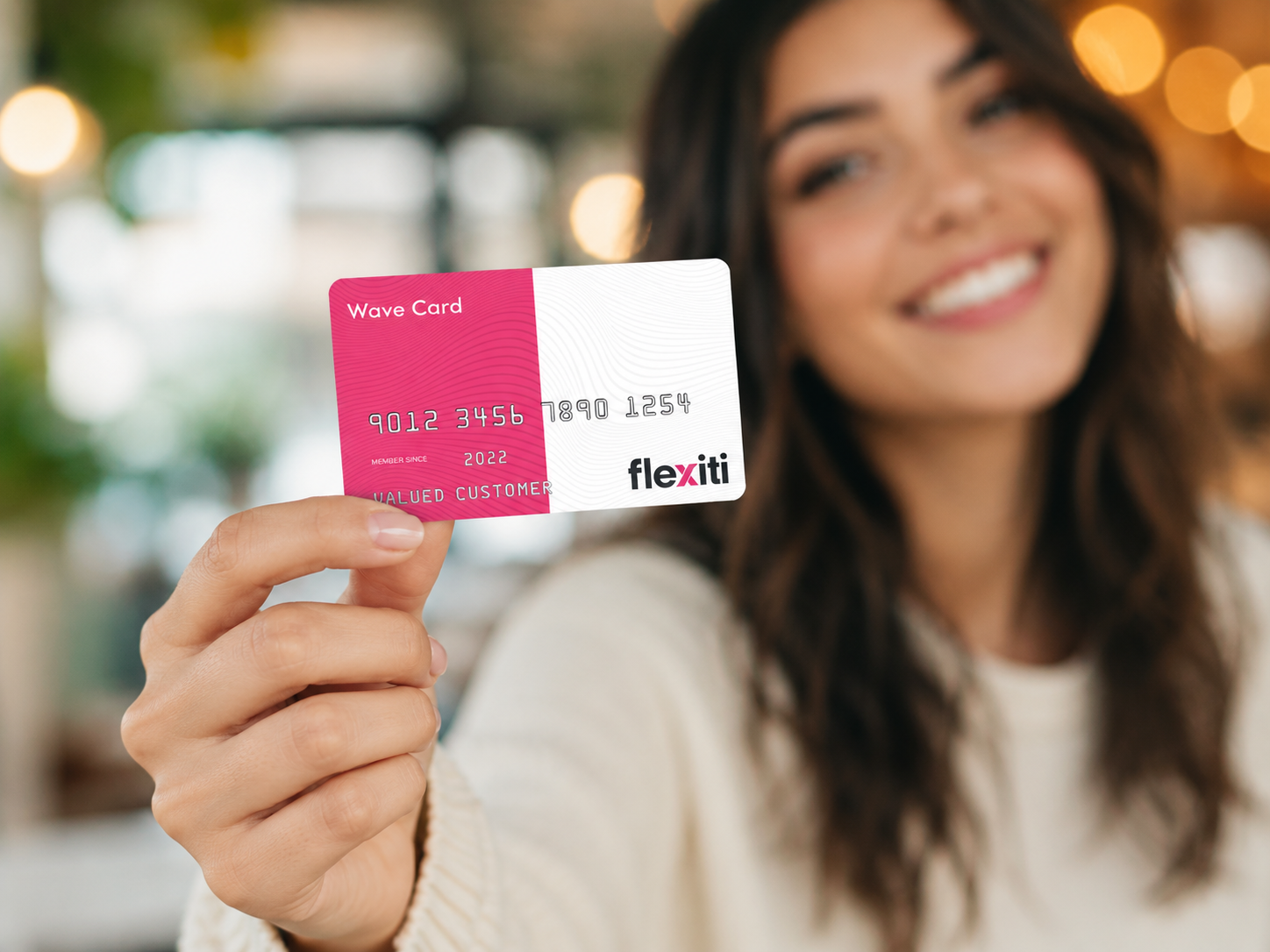 Customer holding a financing card, representing Get Flexible Furniture Financing at Midha's Furniture Gallery with convenient payment options across Brampton, Mississauga, Scarborough, Cambridge, and London.
