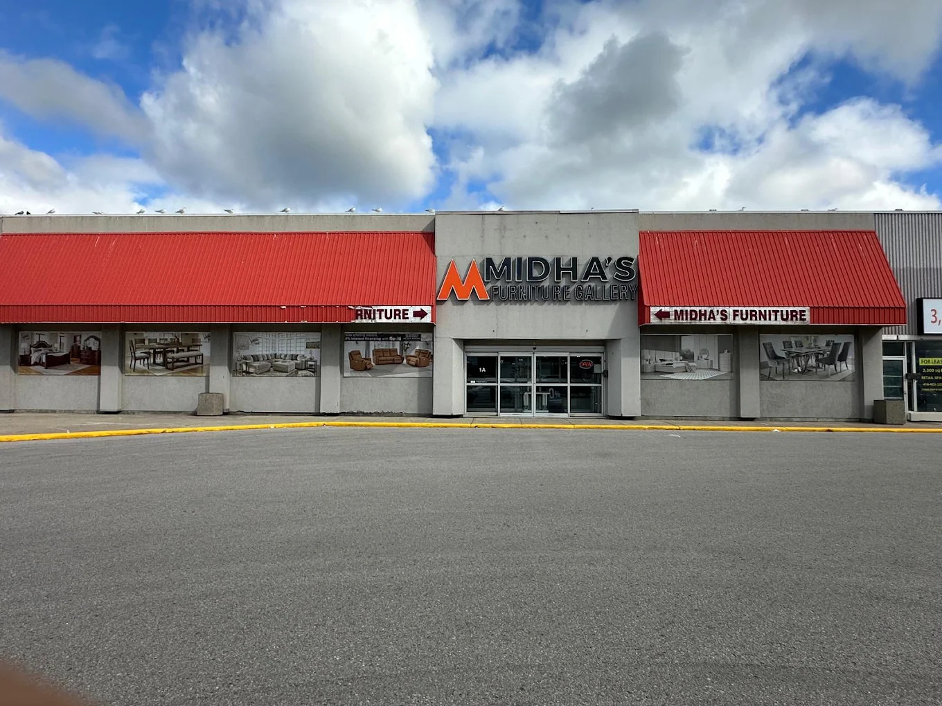 Exterior of Midha's Furniture Gallery Brampton Store in Brampton, Ontario, showcasing the storefront entrance and furniture showroom with a welcoming display.