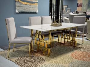 Upgrade your dining space with a cultured marble dining set! Includes a table and 4 velvet-upholstered stainless steel chairs. Expandable seating available.
