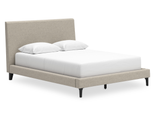 Transform your bedroom with the Ashley Cielden Queen UPH Bed. Featuring chic gray upholstery and a sleek modern design. Shop now for a stylish, cozy upgrade!